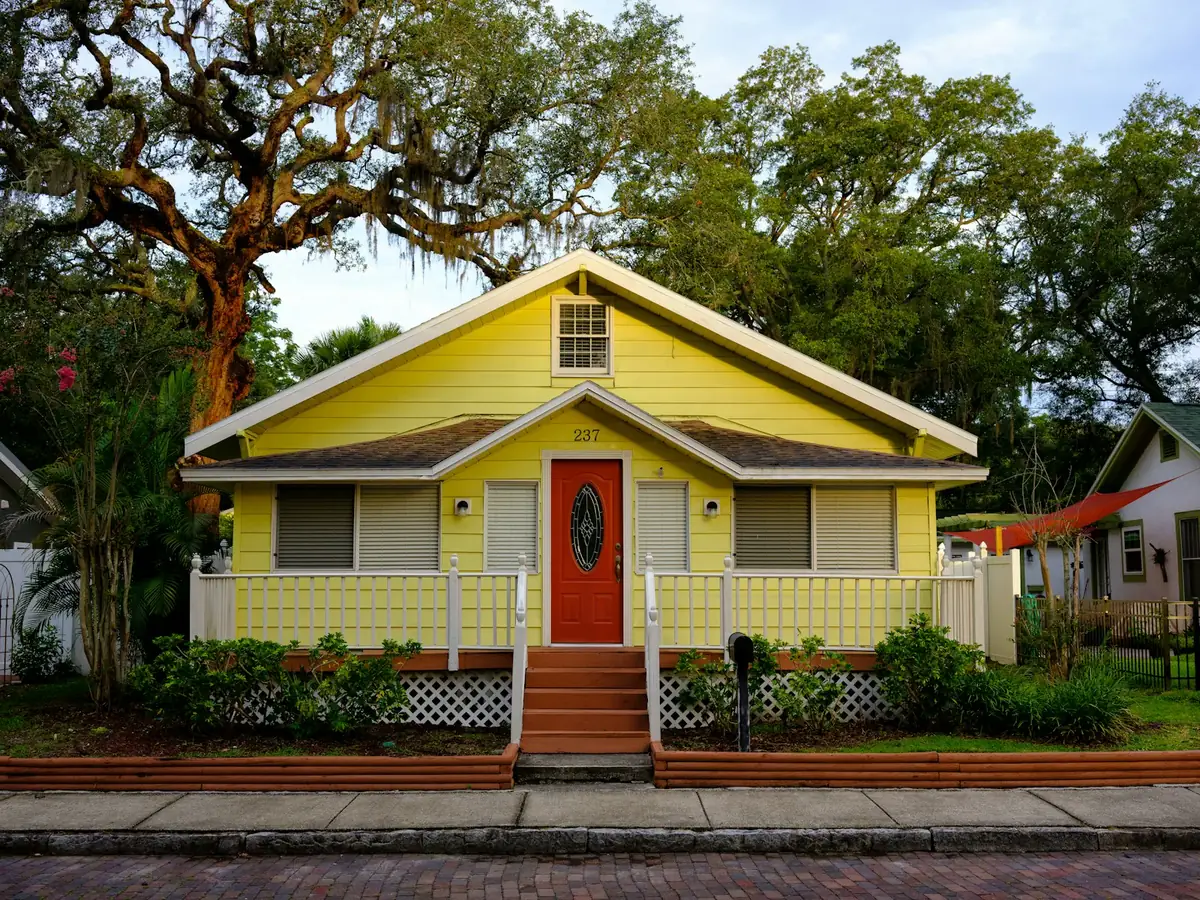 Florida cottage with exterior entry door and windows